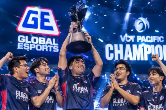 Global Esports players celebrate their VCT Pacific Championship victory as the team captain lifts the championship trophy on stage amid confetti