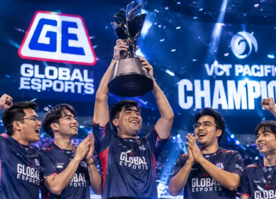 Global Esports players celebrate their VCT Pacific Championship victory as the team captain lifts the championship trophy on stage amid confetti